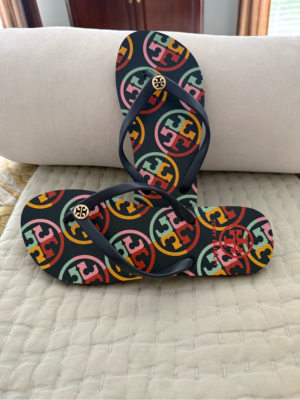 New Tory Burch Navy Strap Flip Flops with Multicolor Logo Print navy base color. - Picture 3 of 10